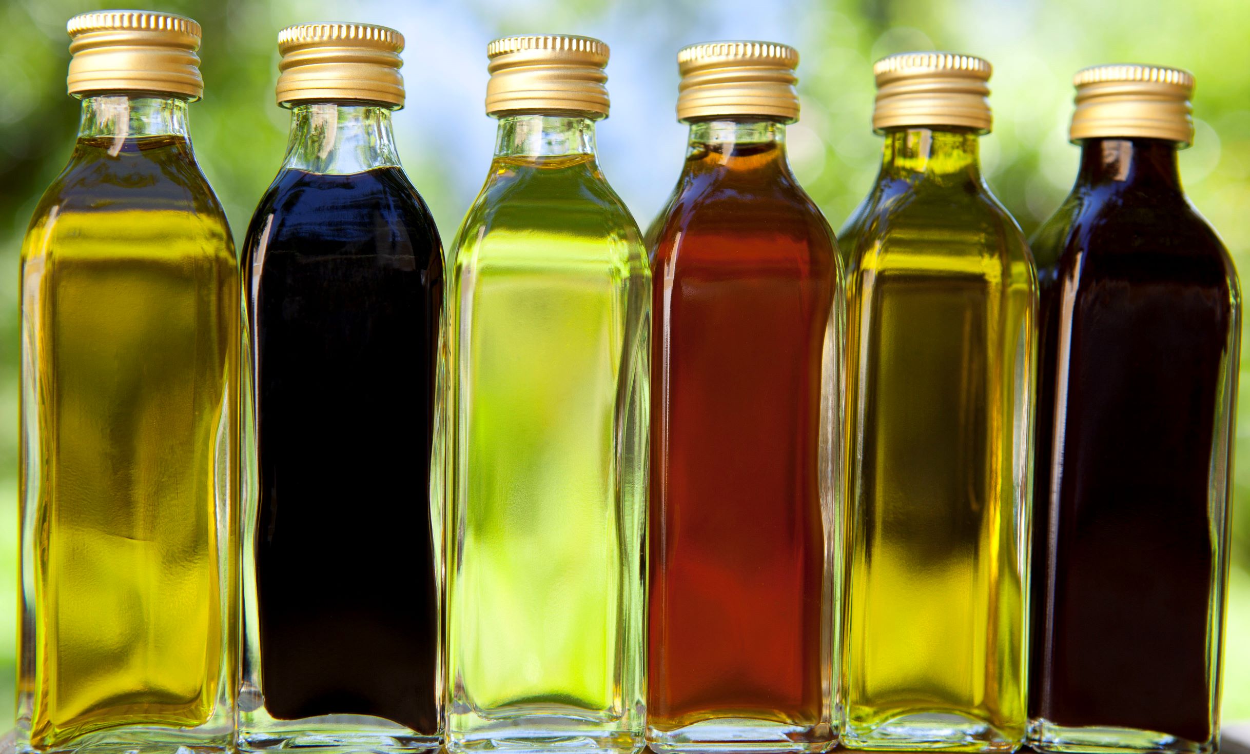 Flavored vinegars in clear bottles